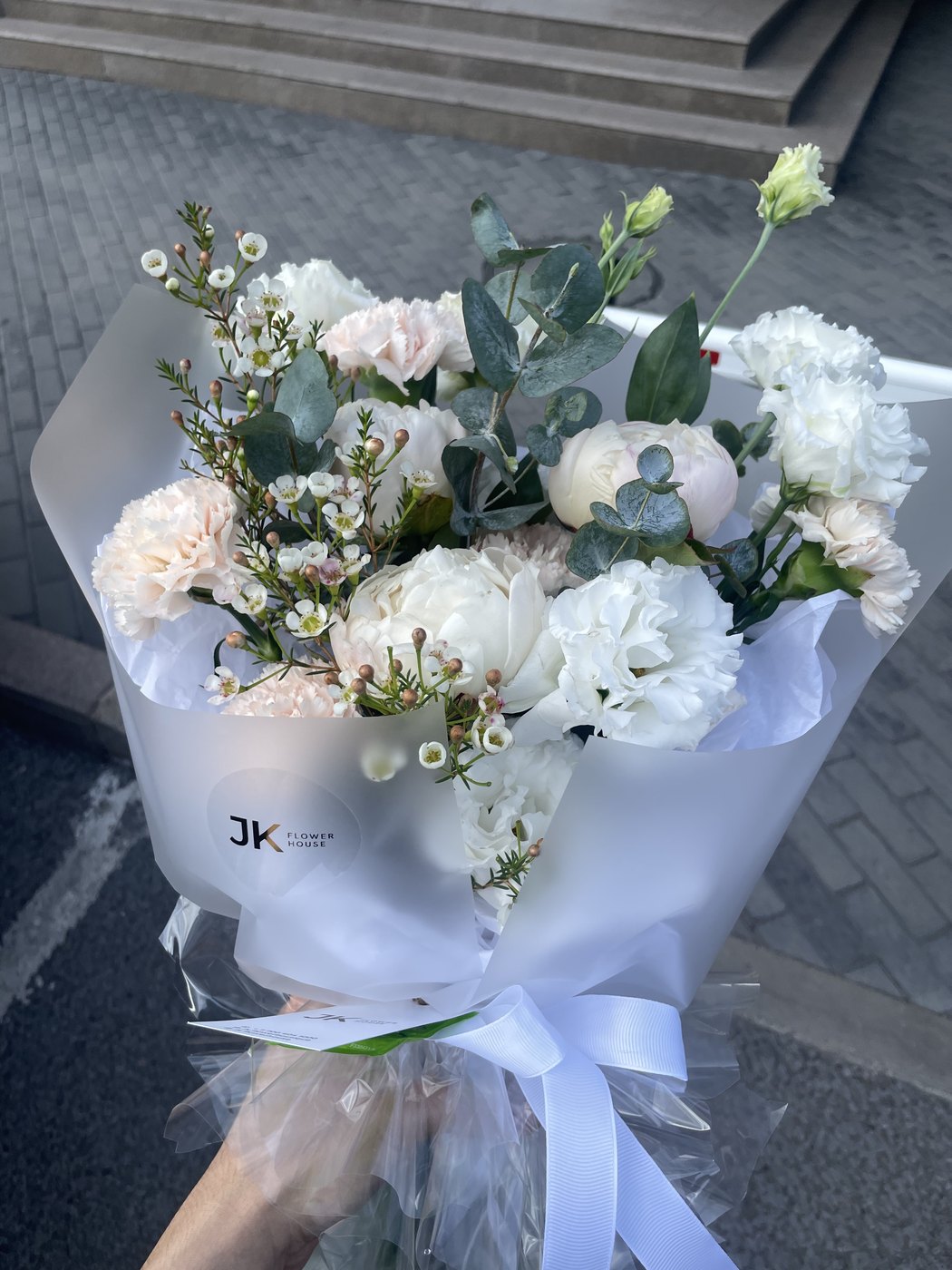 A bouquet of white and pale pink flowers